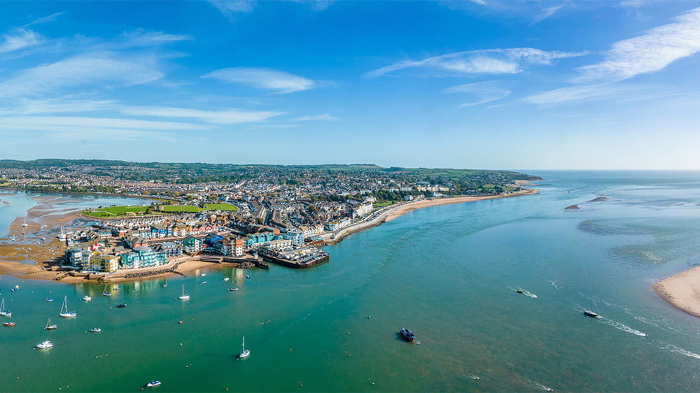 An aerial view over the town of Exmouth and its beach in Devon