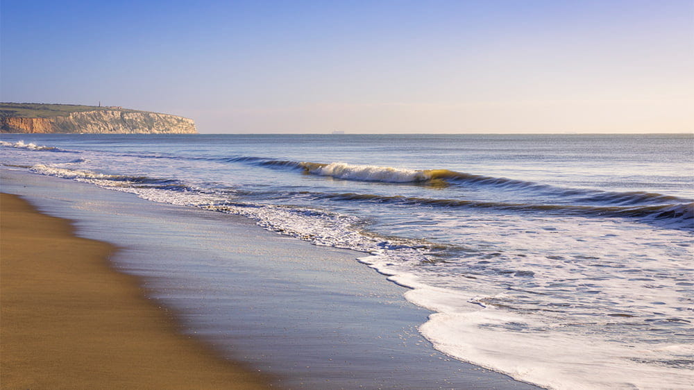 Gentle waves lapping the shore at Sandown Beach on the Isle of Wight