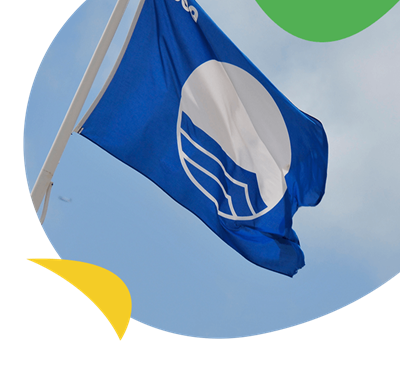 A Blue Flag flying above a beach