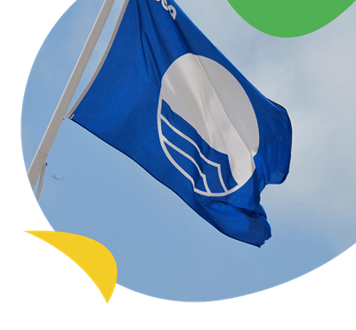 A Blue Flag flying above a beach