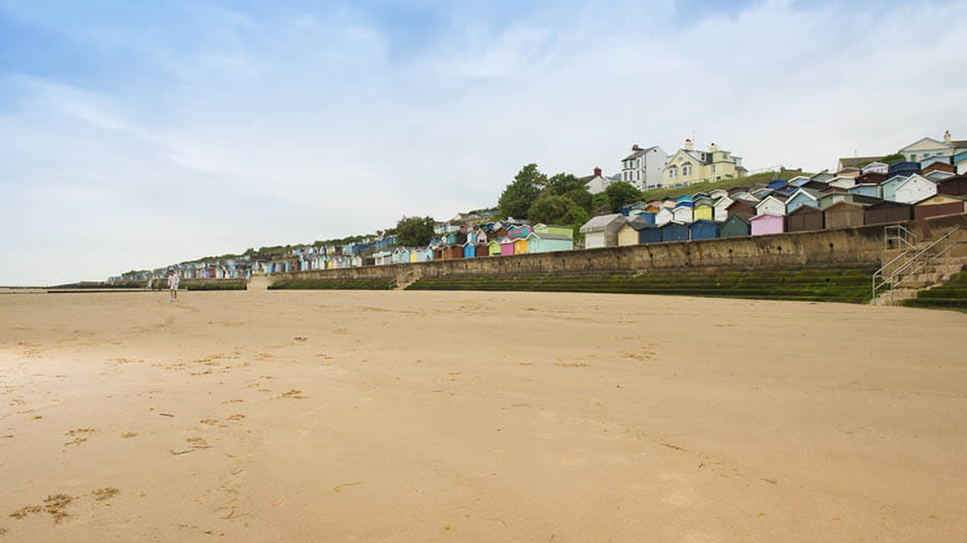 A family playing on the beach at Walton on the Naze