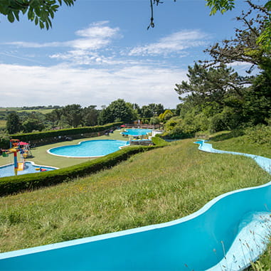 The outdoor swimming pools and slide at Newquay Holiday Park in Cornwall