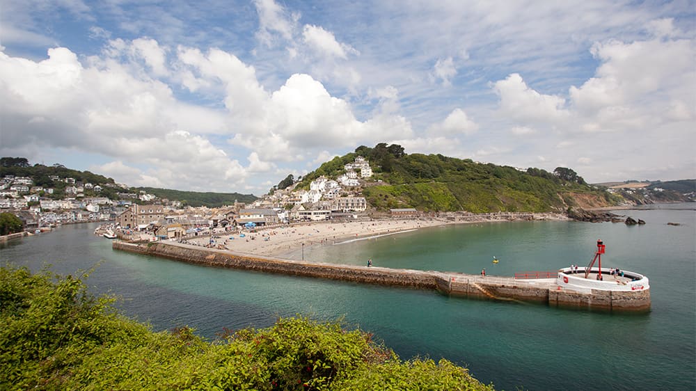 A view over East Looe pier and beach in Cornwall