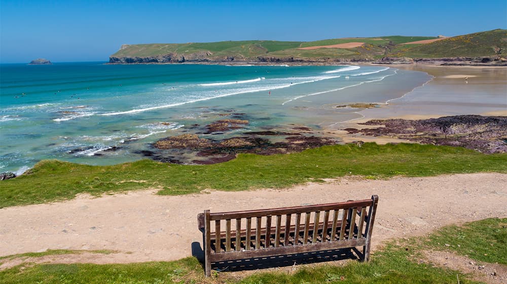 A bench overlooking Polzeath Beach in Wadebridge Cornwall