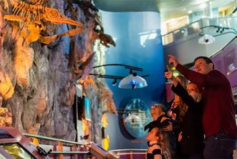 A family looking at an exhibition in The Deep in Hull