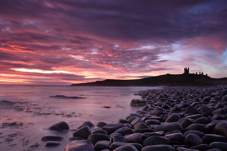 Sunrise at Dunstanburgh Castle on the Northumberland Coast