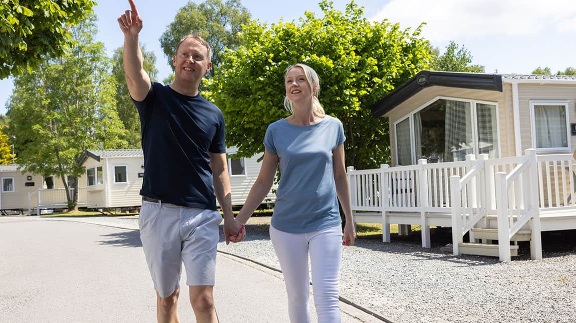 A couple exploring a caravan park