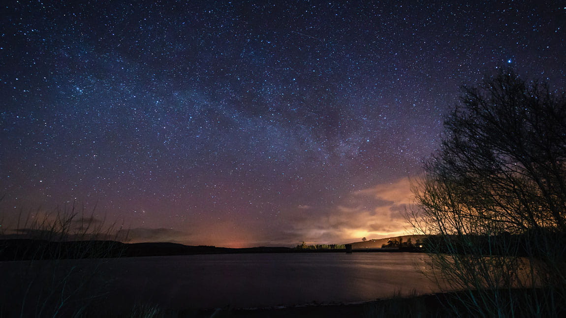 Stars in the sky over a lake