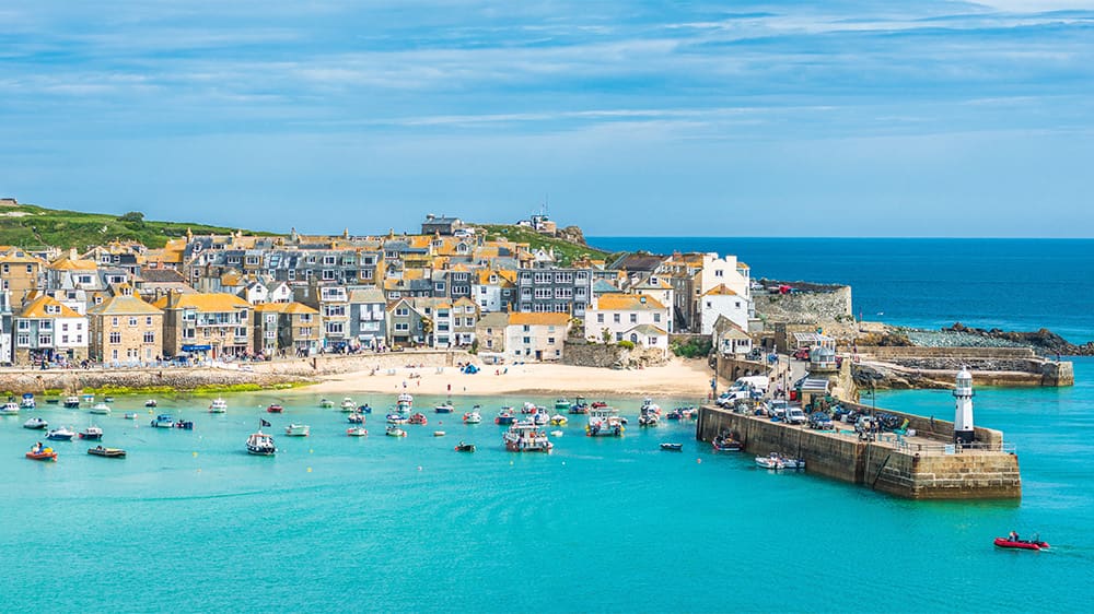 Boats in the harbour with St Ives in the background