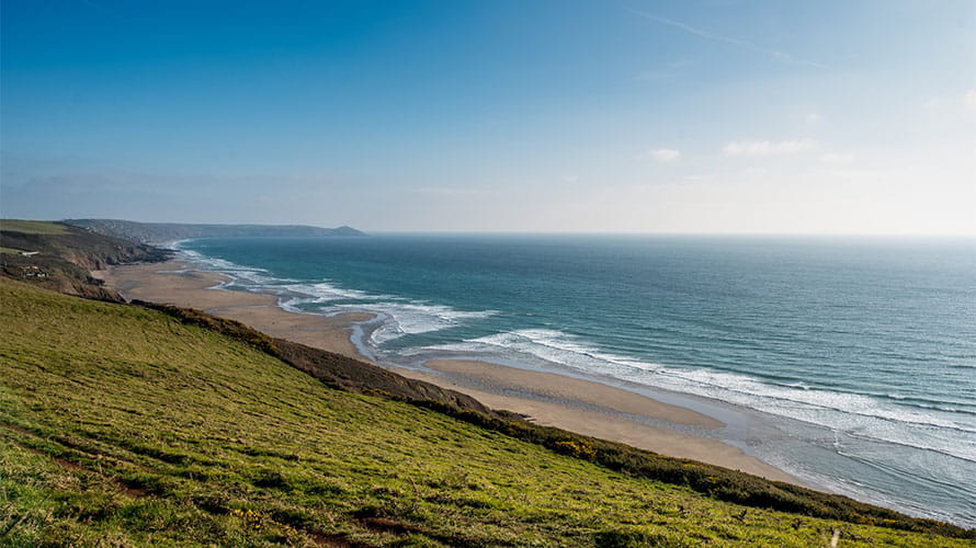 A view of Tregantle Bay in Cornwall, a long, wide and wild sandy beach