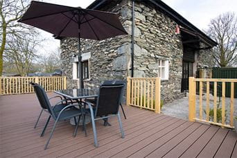 A stone holiday cottage at Fallbarrow Holiday Park