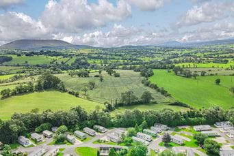 Caravans in the Lancashire countryside, overlooking Pendle Hill