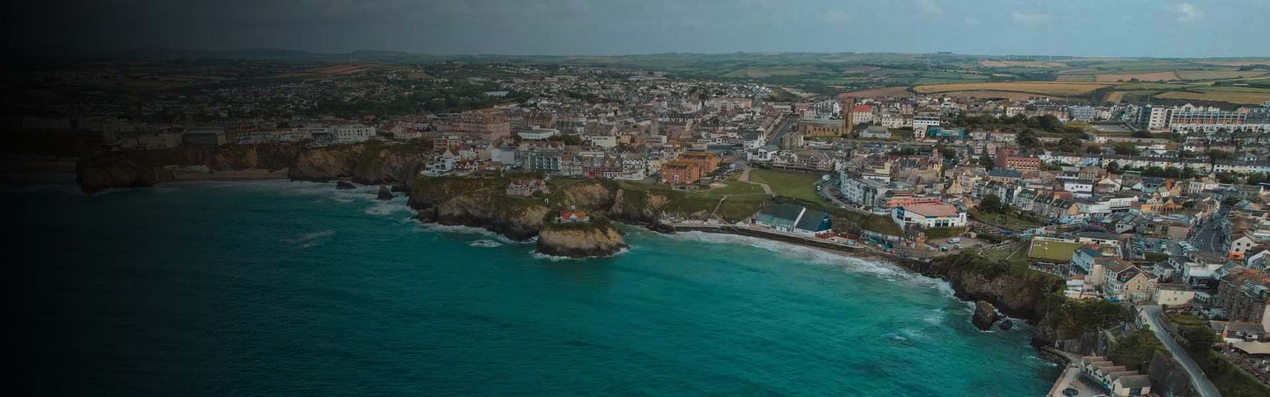 An aerial view over Newquays coastline