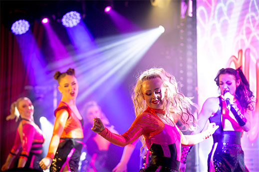 Dancers performing on stage at Parkdean Resorts
