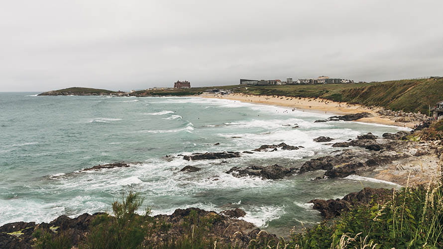 A stormy day at Fistral Beach in Newquay with the Towan Headland visible beyond