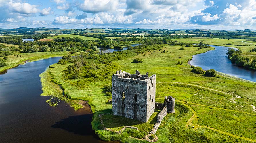 A castle surrounded by a river in Scotland's Dumfries' countryside
