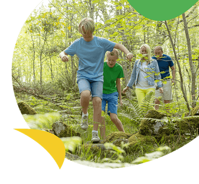 A family walking through the woods