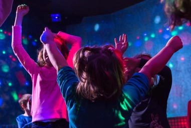 Kids dancing under a discoball