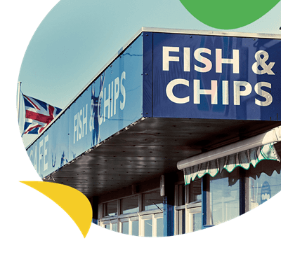 A sign on the front of a fish and chip shop in the UK