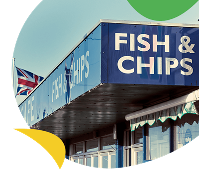 A sign on the front of a fish and chip shop in the UK