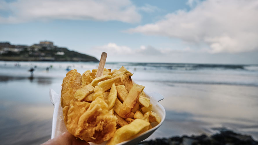 A tray of takeaway fish and chips at the beach