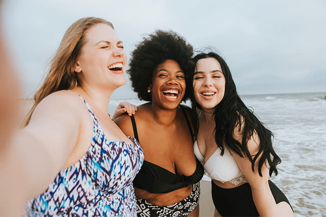 Friends taking a selfie at the beach