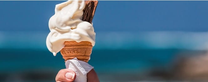 A whippy ice-cream cone and flake melting in the sun