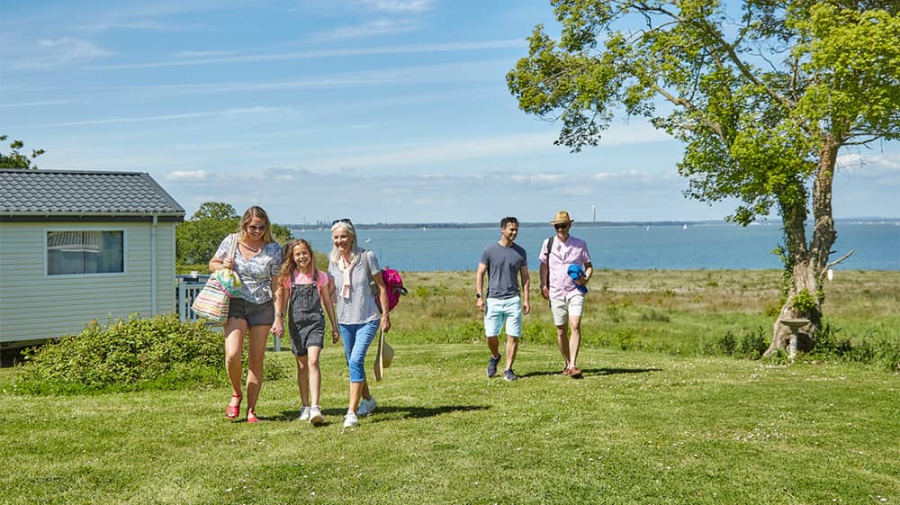 A family walking back from the beach at a holiday park on the Isle of Wight