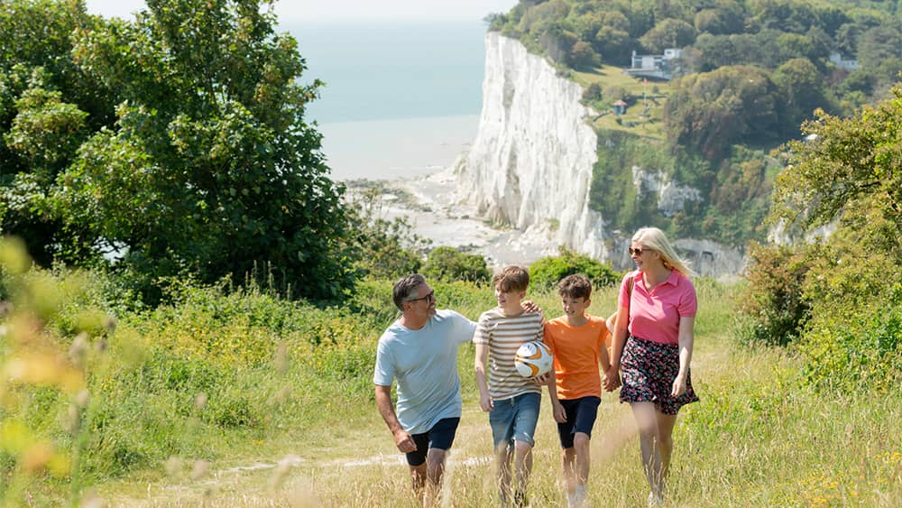 A family going for a walk along the white cliffs of Dover