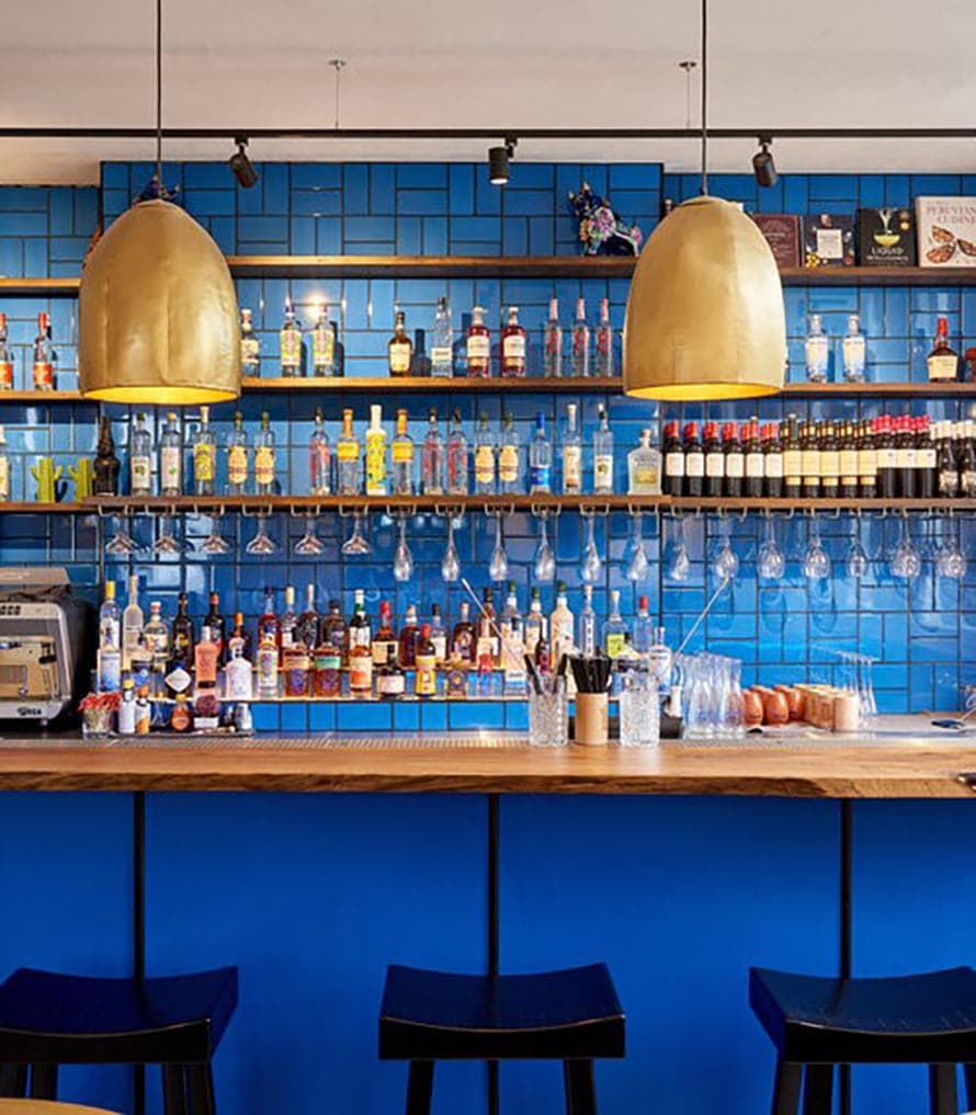 A blue tiled bar at Chakana in Birmingham