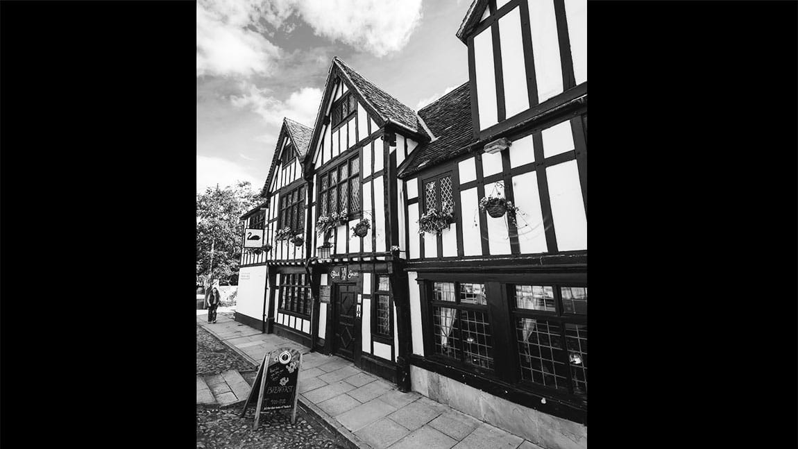 A black and white photo of the Black Swan Inn in York
