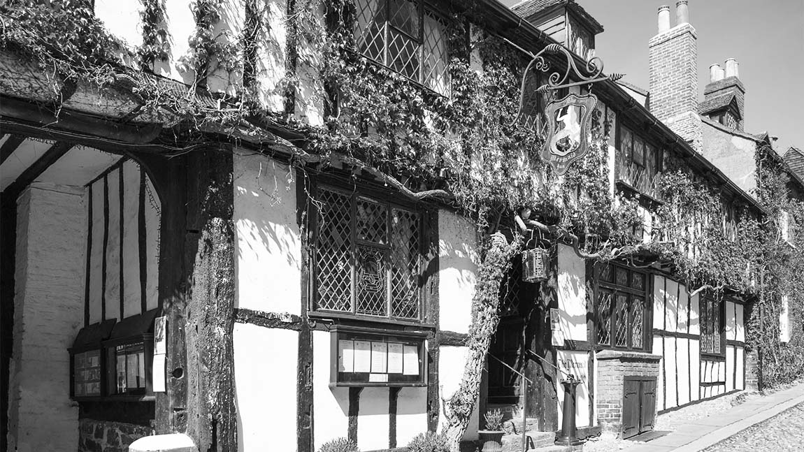 A black and white photo of the Mermaid Inn in Rye
