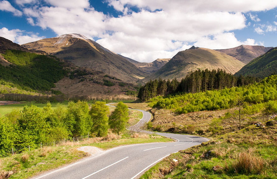 A winding road through the Scottish Highlands