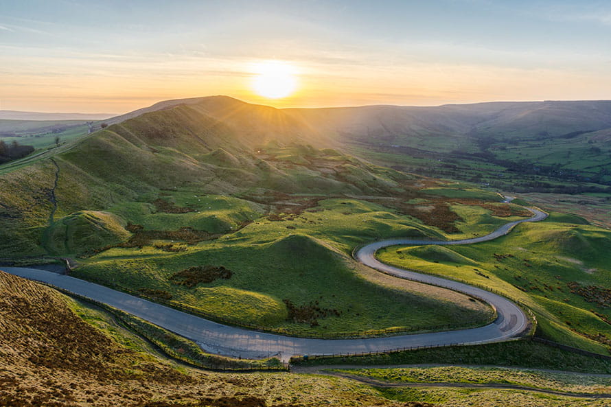 A road winding through the hills of the Peak District