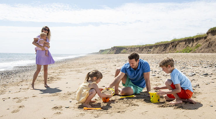 A family enjoying a day at the beach