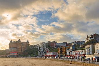 Amusements and a ferris wheel on Scarborough beach promenade