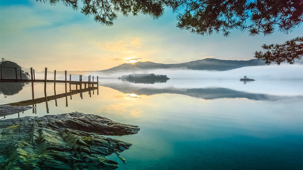 A misty sunrise overlooking Derwentwater in the Lake District