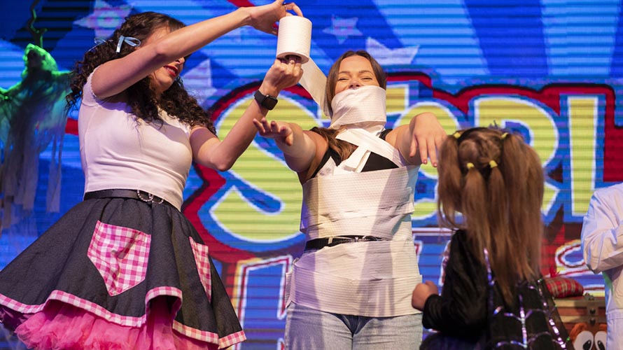 Kids making a costume on stage at Parkdean Resorts