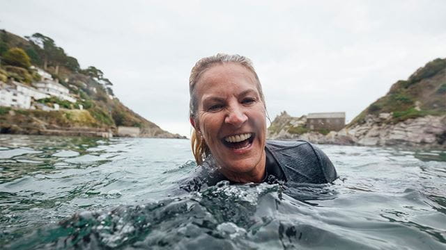 A woman swimming in the sea in Cornwall