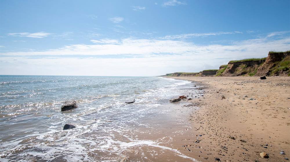 Waves lapping a beach on the North Yorkshire Coast
