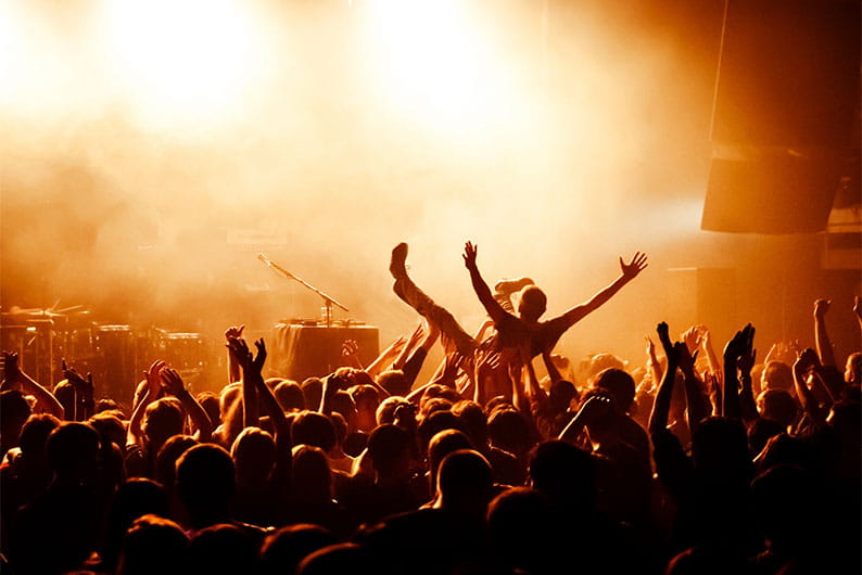 A musician crowd surfing at a music festival