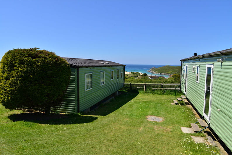 Caravans overlooking the sea at Crantock Beach Holiday Park