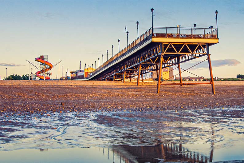 The pier on Skegness Beach at sunset