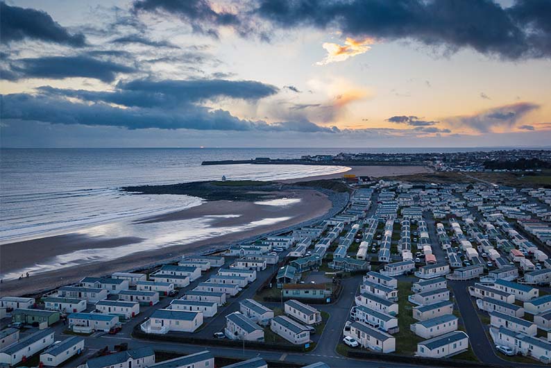 An aerial view over Trecco Bay Holiday Park and Porthcawl in South Wales