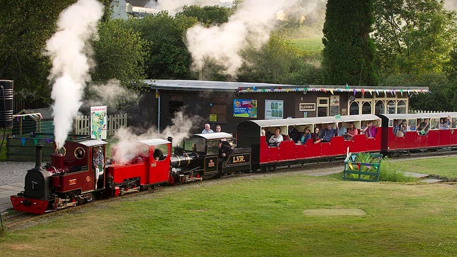 Families riding a miniature steam train at Lappa Valley in Cornwall