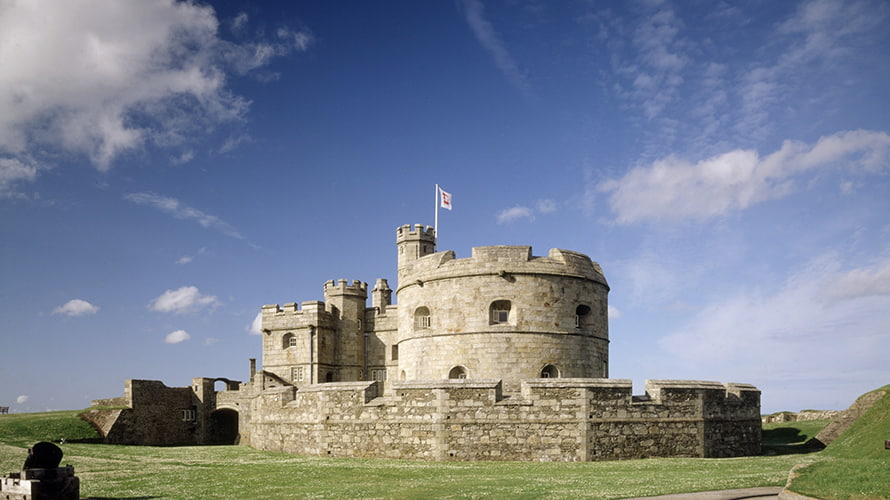 A stone castle flying a flag