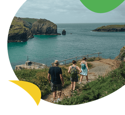 A family going for a walk along the Cornish coast