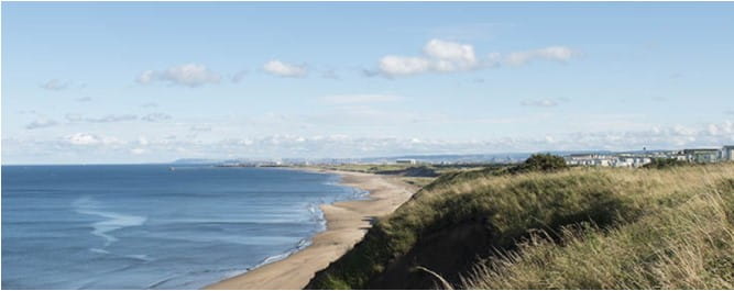 Caravans overlooking the beach at Crimdon Dene Holiday Park