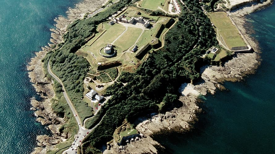 An aerial photo of Pendennis Castle on top of a headland surrounded by sea