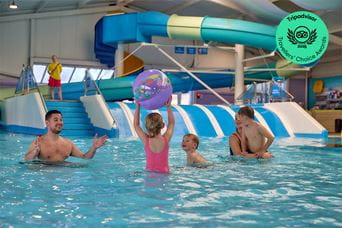 A family splashing in the pool at Cayton Bay Holiday Park in North Yorkshire